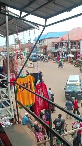 Bustling Nigerian marketplace documented during midday trading hours