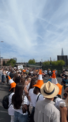 London marathon draws crowds wearing orange cone hats