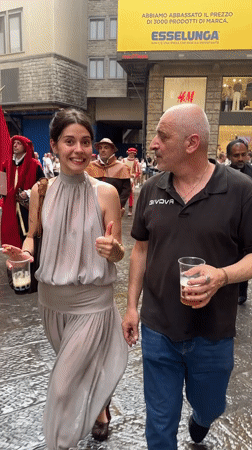 Renaissance parade with costumed performers marches through Florence streets