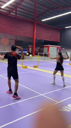 Badminton match captured on indoor court in Ko Samui