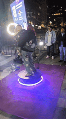 Nighttime street parade with marching bands draws crowds in La Paz