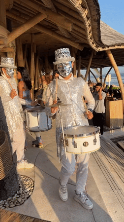 Disco ball performers and live drums at a Bali outdoor event