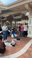 Evening crowds pack Tokyo Disneyland amid cloudy weather