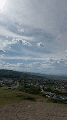 Dog walker documents hillside views in Markovo, Bulgaria