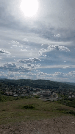 Dog walker documents hillside views in Markovo, Bulgaria