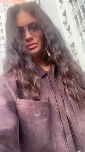 Woman records selfie videos on street in Krasnogorsk