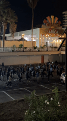 Nighttime group dance performance draws dozens to Arica parking lot