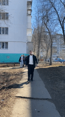 Man walks with object on path in Chaikovsky