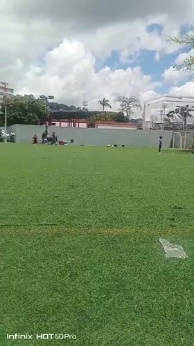 Clowns, soccer, and crowds at a Caracas turf field event