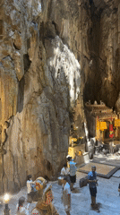 Tourist documents Buddhist cave temples at Marble Mountains Vietnam