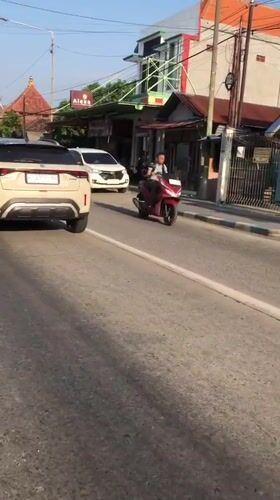 Morning traffic flows through three East Java roadside villages
