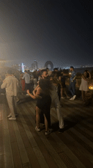 Night dancing on Baku's waterfront boardwalk