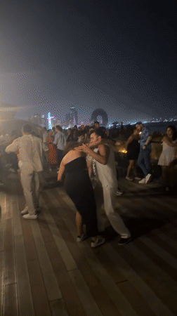 Night dancing on Baku's waterfront boardwalk