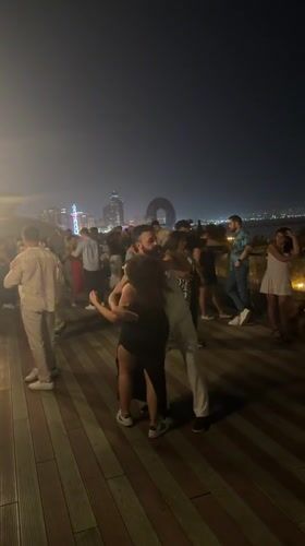 Night dancing on Baku's waterfront boardwalk