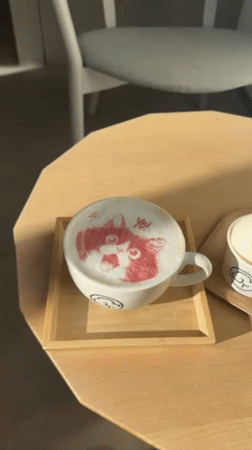 Morning café scene captured in Shibuya with fox latte art