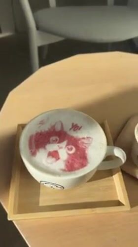Morning café scene captured in Shibuya with fox latte art