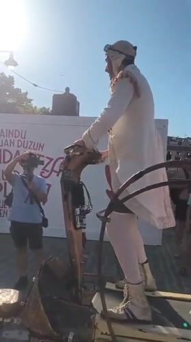 Street festival and dragon performance outside Lekeitio's stone church
