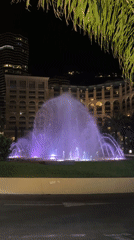 Monaco nighttime scenes feature illuminated fountains and casino district