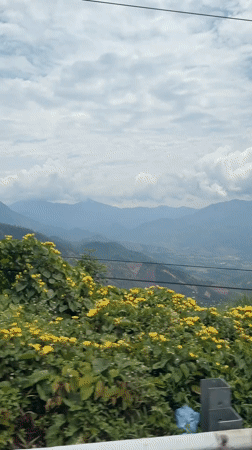 Vehicle travels mountain road in Nam Khanh Vinh, Vietnam