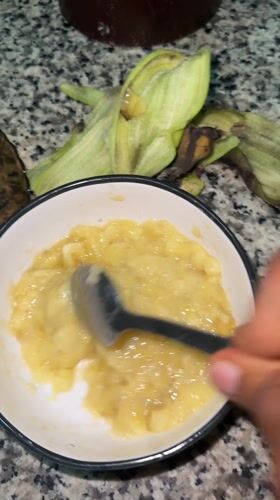 Banana mashed with spoon in bowl, Sabon Tasha
