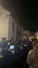Religious procession with musicians moves through Córdoba streets