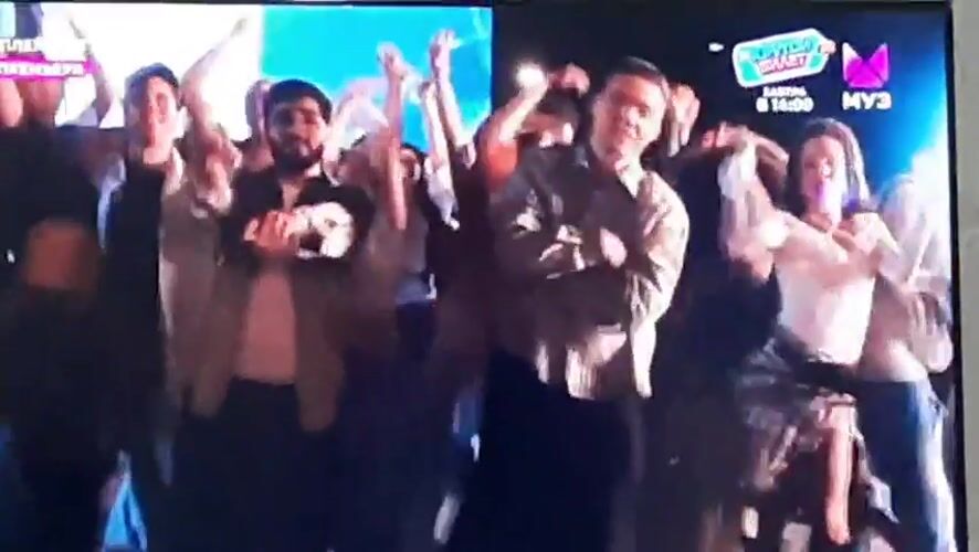 Crowd dancing at an outdoor concert in Gudermes, Russia