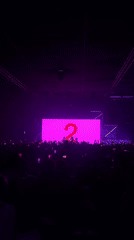 Live concert in London, purple lights and pink screen