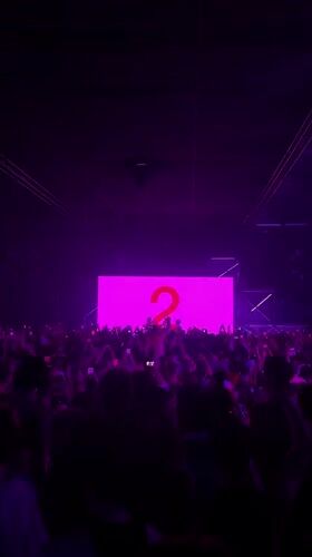 Live concert in London, purple lights and pink screen