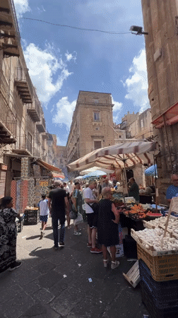 Morning market activity documented across Palermo food stalls
