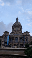 Evening tourist activity captured around Barcelona's National Art Museum