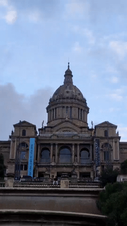 Evening tourist activity captured around Barcelona's National Art Museum