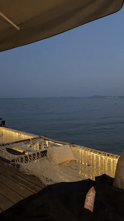 Cozy lit deck with hammock by the water in Ravda