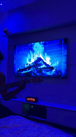 Guitarist performs in blue-lit room for social media challenge
