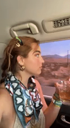 Woman with colorful hair clips recorded inside vehicle in Whitewater