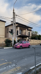 Pink car navigates residential streets in Gelendzhik, Russia