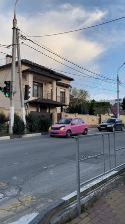 Pink car navigates residential streets in Gelendzhik, Russia