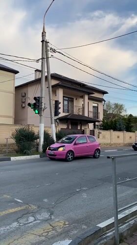 Pink car navigates residential streets in Gelendzhik, Russia