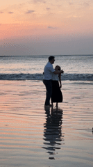 Sunset crowds and couples on a Kuta Selatan beach