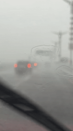 Heavy rainstorm reduces driving visibility in Kuta Selatan
