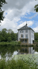 Lakeside building, parked motorcycle, and a very relaxed cat in Heilbronn