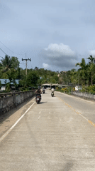 Morning motorcycle traffic observed on rural Thailand roads