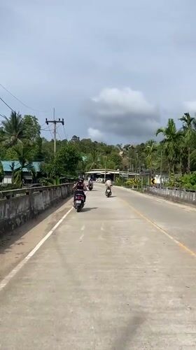 Morning motorcycle traffic observed on rural Thailand roads
