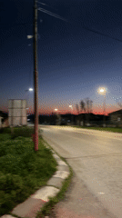 Evening traffic captured on illuminated street in Bulgarian village