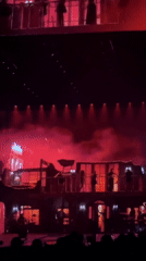 Concert performance features elaborate stage set and cosmic visuals