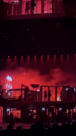 Concert performance features elaborate stage set and cosmic visuals