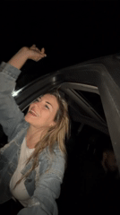 Woman sings, dances in car backseat in Montenegro