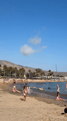 Crowded summer beach day in Arona, Tenerife