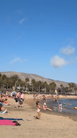 Crowded summer beach day in Arona, Tenerife
