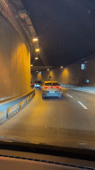 Vehicle drives through lit tunnel in Üsküdar, Turkey