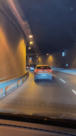 Vehicle drives through lit tunnel in Üsküdar, Turkey